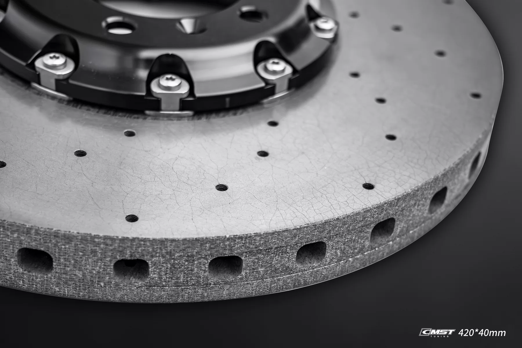 Aluminium hat and T-shaped drive clips on a CMST carbon-ceramic disc