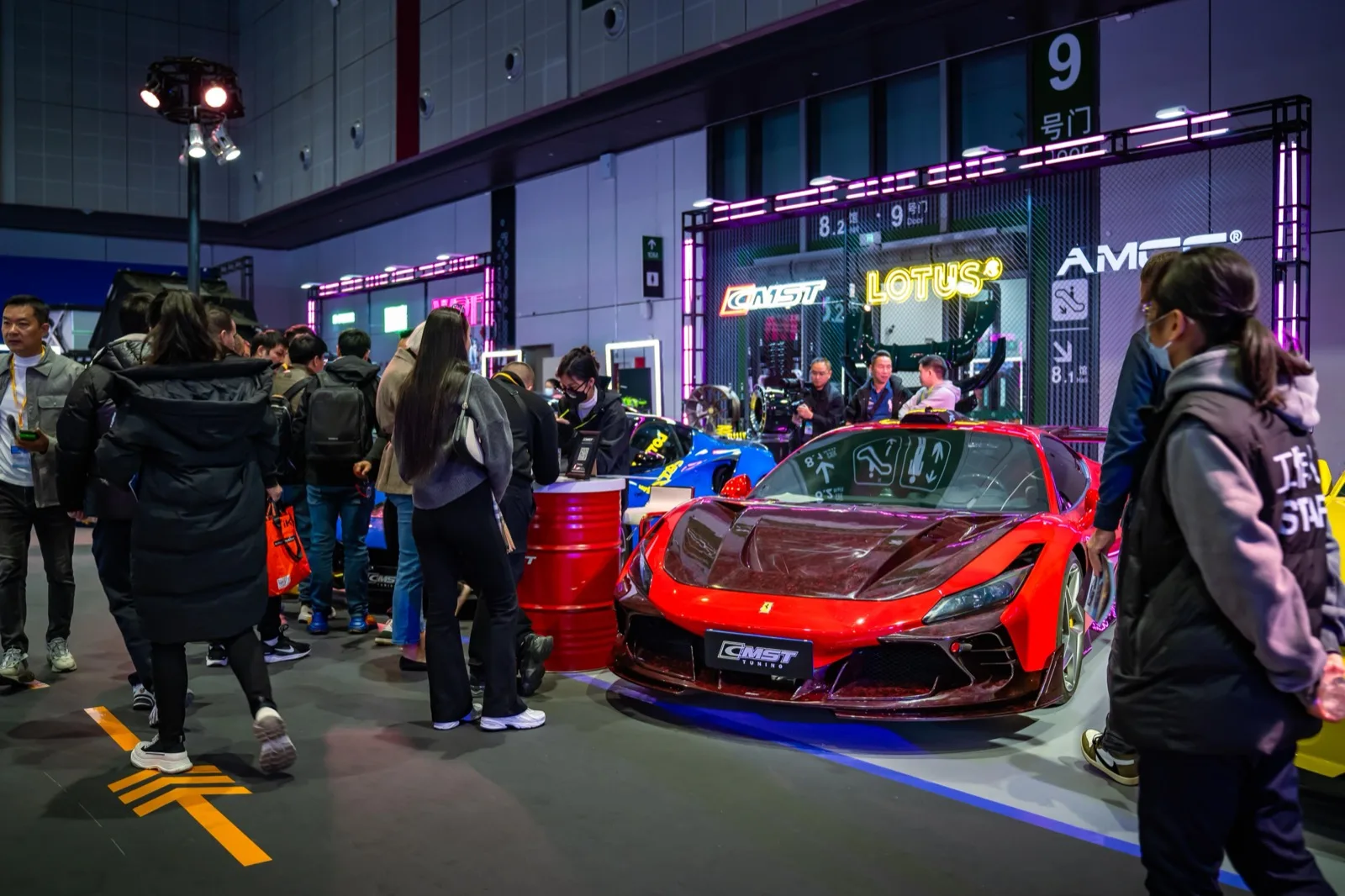 A red Ferrari F8 on CMST aero, on the show floor by door 9